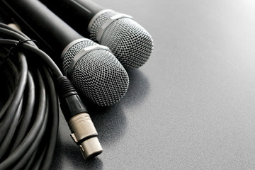 Obraz premium radio microphones. wireless sound transmission system. Microphones are on the audio wires. soft focus. Two mics