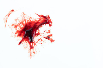 real sticky blood splatters on white background from  a cough of operation patient. concept : sick, illness, murder, halloween. © Rattanachat