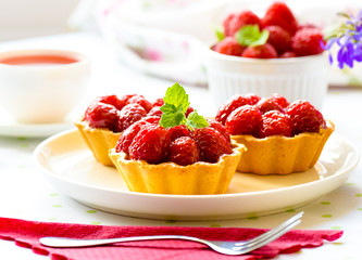 Fruit raspberry cakes on a table