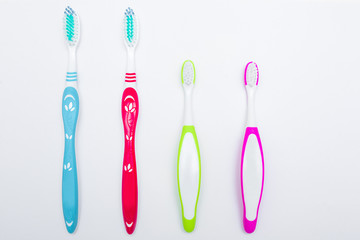 Toothbrushes on neutral background. Family hygiene concept.