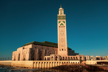 Fototapeta premium scenic view of Hassan II mosque from the walk alley at sunset - Casablanca - Morocco