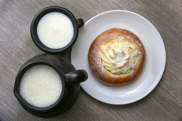 Still life with milk and sweet pastries on the table