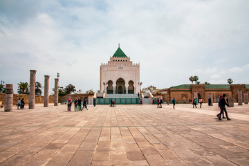 Fototapeta premium The Mausoleum of Mohammed V is a historical building located on the opposite side of the Hassan Tower on the Yacoub al-Mansour esplanade in Rabat, Morocco