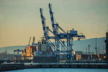 Fototapeta na wymiar Large container ship under sea port service.
