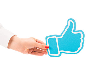partial view of woman holding thumb up blue sign isolated on white