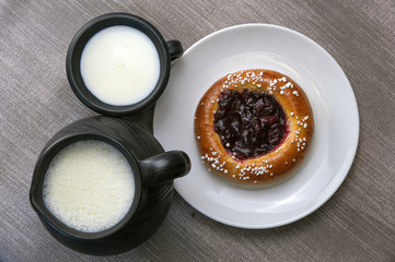 Still life with milk and sweet pastries on the table