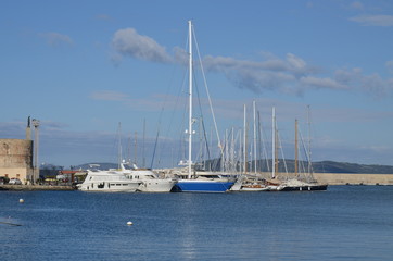 Fototapeta na wymiar White boats in Alghero harbor
