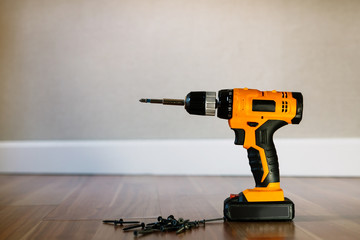 drill with nails on the background