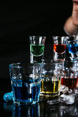 Barman show with colorful cocktails
