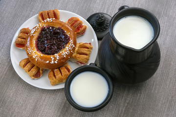Still life with milk and sweet pastries on the table