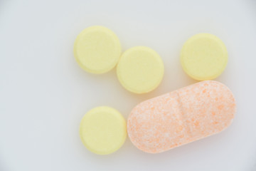 Pills on a light background close up. View from above.