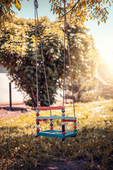 Colorful plastic swing in the park.