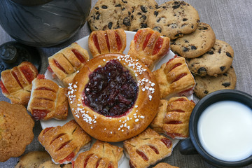 Still life with milk and sweet pastries on the table
