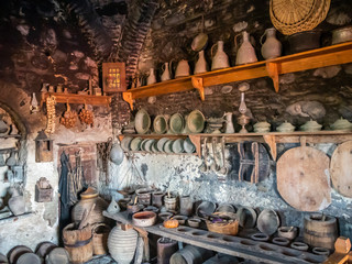 Ancient utensils on the ancient kitchen in the Megala Meteora monastery in Meteora region, Greece