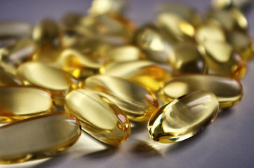 Fish oil capsules with omega 3 and vitamins A & D. Healthy lifestyle. Pharmacy industry.Healthy...