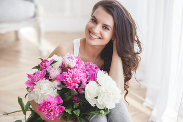 Close up portrait of young beautiful woman with flowers