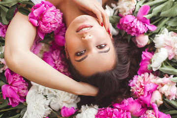 Close up portrait of young beautiful woman with flowers