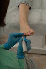 Process of medical pedicure. Foot care. Podology