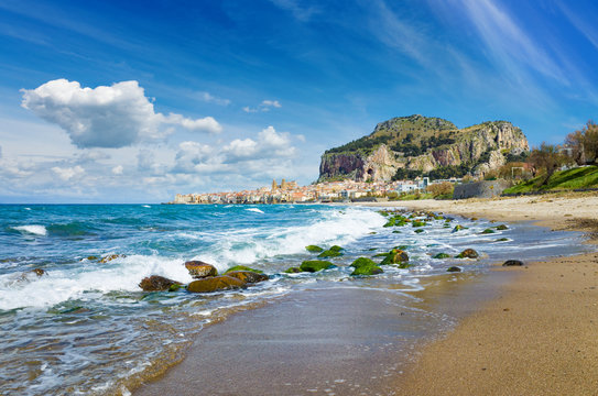Long beach and blue sea near Cefalu, Sicily, Italy