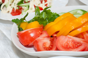 Vegetable sliced red tomato, yellow pepper close-up on the festive table. Birthday party