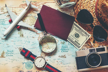 .Top view of Traveler accessories and items man with black for planning travel vacations on the world, copy space.  Travel and Summer holiday concept