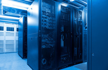 Parallel rows connected servers and internet cable infrastructure in big datacenter