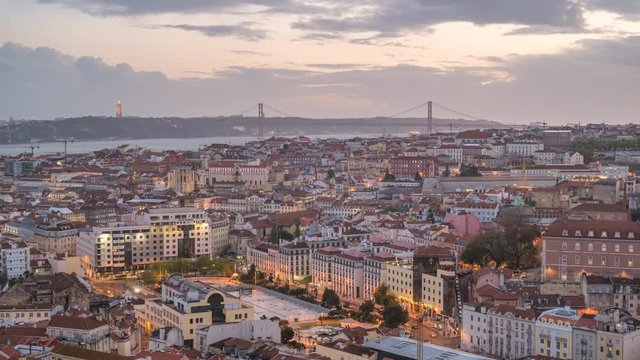 Lisbon Portugal time lapse 4K, aerial view city skyline day to night sunset timelapse at Lisbon Baixa district