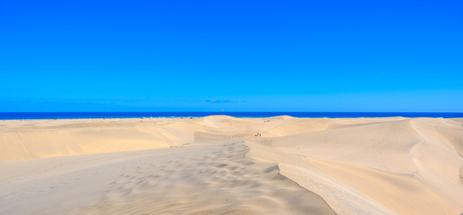 Fototapeta na wymiar Aerial View of Sand Dunes in Gran Canaria with beautiful coast and beach, Canarian Islands, Spain