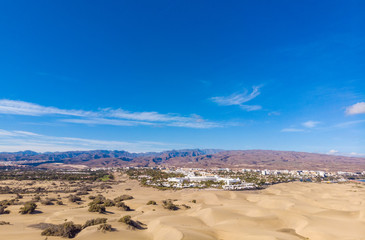 Aerial View of Sand Dunes in Gran Canaria with beautiful coast and beach, Canarian Islands, Spain