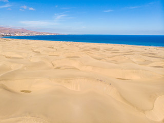 Fototapeta na wymiar Aerial View of Sand Dunes in Gran Canaria with beautiful coast and beach, Canarian Islands, Spain
