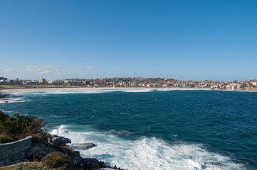 Fototapeta na wymiar Bondi beach panorama with calm ocean on a sunny day