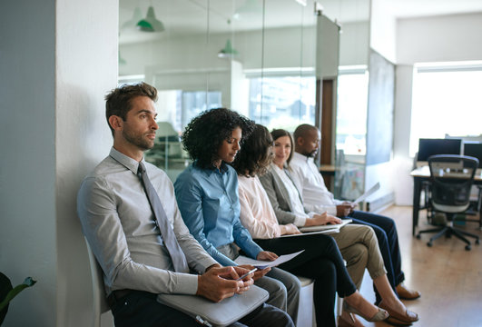 Group Of Diverse People Waiting For Interviews In An Office