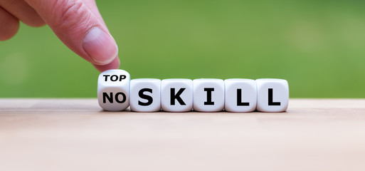 Hand turns a dice and changes the expression "no skill" to "top skill".