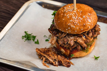Close up tasty burger with minced meat served on tray