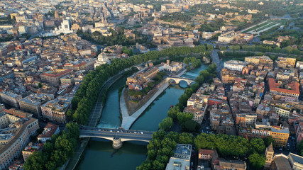 Fototapeta na wymiar Aerial view of hospital on the Tiber Island, on the Tiber River, Rome, Italy. Coliseum.