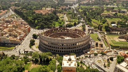 Photo sur Plexiglas Colisée Aerial view on the Coliseum, Rome, Italy. Spring, summer. Ancient Rome architecture from drone.