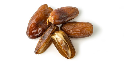 Dried of sweet dates palm fruits on white background. Dates is a dried fruit that provides high energy.