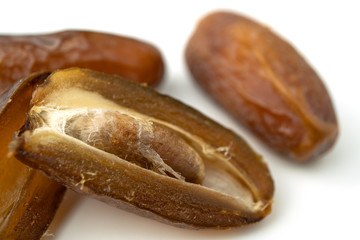 Dried of sweet dates palm fruits on white background. Dates is a dried fruit that provides high energy.