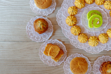 Cake Roll Cookie Cupcake Banana Cupcake Garlic Bread on White Wooden Table