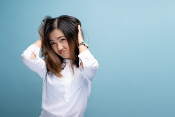 Woman scratching her head