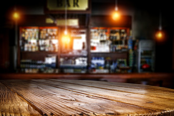 Table background of free space and blurred background of bar 