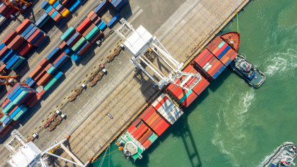 Fototapeta na wymiar Container ship in export and import business logistics and transportation. Cargo and container box shipping to harbor by crane. Water transport International. Aerial view and top view.
