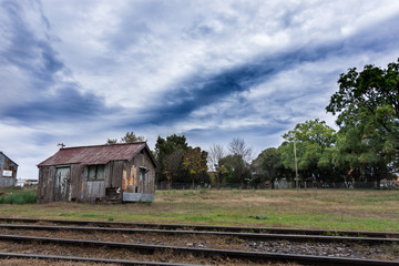 Fototapeta na wymiar Old wooden house in abandoned train station