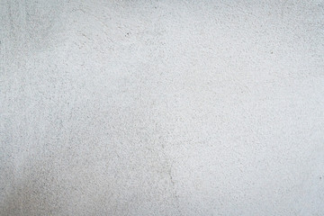 Texture of concrete wall surface painted with white color. Suitable for use as a pattern or background image for use in graphic design.