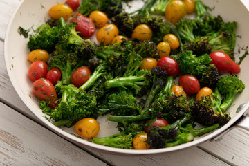 Green Broccoli Florets Sauteed with Heirloom Cherry Tomatoes and Fresh Herbs