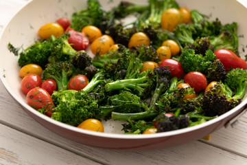 Green Broccoli Florets Sauteed with Heirloom Cherry Tomatoes and Fresh Herbs