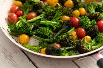 Green Broccoli Florets Sauteed with Heirloom Cherry Tomatoes and Fresh Herbs
