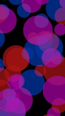 Multicolored translucent circles on a dark background. 3D illustration