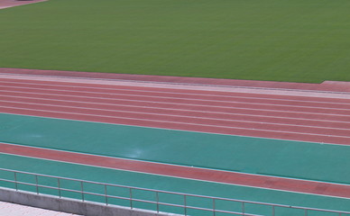 Red race track of athletic field