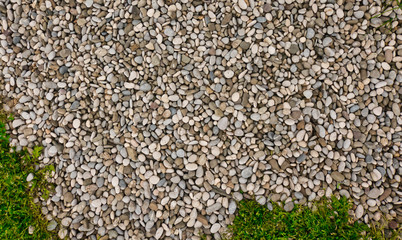 Pebble ground outdoors after the rain.